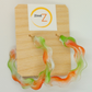Colorful earrings on a wooden display card with 'Zind Z' branding.